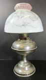 Antique Rayo silver oil lamp with original glass shade, approx. 17H. Burner is marked Pat'd Feb 28.05 and shade holder is marked Pat'd Feb 16.97.