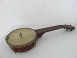 Antique banjo. The wood bridge piece needs re-applied. Approx.21L