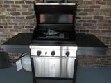 Commercial series Char-Broil grill with accessories, tank and cover. Unit does not have side burners.