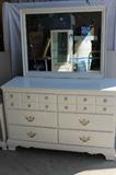 Fabulous vintage white dresser and matching side table. The hardware is adorable with flowers on it. The dresser measures 49x18x32.
