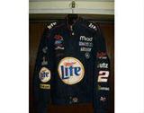 Very Nice Rusty Wallace Miller Lite race team style men's jacket. Size: large. Made by Chase Authentics. Snap front. Sponsors include: Planters, Amtrak, Nikon, Goodyear, Ford, Jack Links Beef Jerky, Utz, Haribo Lennox, Mobile 1, Mead. Large (approx.11" dia.) Miller Lite patch on back.
