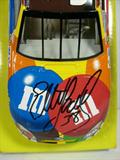 2004 Winner's Circle 1:24 scale Elliott Sadler #36 M&M's Ford Taurus. Autographed in black Sharpie on the hood, no COA.