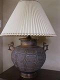 Stunning and unique glass lamp with natural pleated shade, 31" tall, replica of ancient Chinese urn, not sure which dynasty; purchased from furniture store in Columbus in 1975 to decorate newly opened professional office.  A great find! In excellent condition