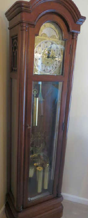 Colonial grandfather clock, lunar calendar face, 3 counter weights, pendulum, 3 chimes including Winchester, St. Michaels, and Whiter chimes, made in USA, solid Mahogany cabinet, approx. 22"w x 11"d x 80"t, excellent condition