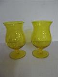 A pair of simply marvelous brilliant marigold yellow hand blown stems. Each is 6" high, and each is in mint condition. These are unmarked but they are very similar in color to Steuben's Bristol. I will leave the decision as to whether they could be Steuben to you, but I think the possibility is strong that they are (unmarked Steuben is not unusual).  Please see the previous two lots for more of these amazing glasses.