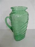 A 9.5" high Consolidated Glass Catalonian green pitcher with applied handle. This is to die for cool. It was made in 1927, and it is RARE! I love the ridges, bubbles, inclusions, the whole thing! Ready to enjoy.