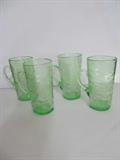 The Consolidated Glass Company was founded in 1926 in Coraopolis, Pennsylvania. In 1927 they introduced the Catalonian line, and this great auction has many, many of those very collectible pieces. 
This hand blown line is known for its distinctive look with bubbles, blisters, and inclusions intentionally left in the glass. 
This lot has four handled glasses, each 5.5" high. They are in great condition, ready to love. And, there are a total of 11 of these hard to find glasses (see the next 2 lots).