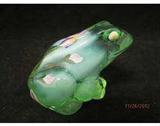 Hand painted Fenton frog.  The frog has an iris design.  Signed by artist M. Kibbe  Has Fenton mark and sticker.  The frog measures approx. 2.5 h and has original box.