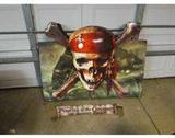 OK, This is REALLY cool! Huge cardboard Disney's Pirates of the Caribbean at World' End sign. The box is approx 4.5"D 44"W 26"H with additional height of the bones crossing and skull. The skull and ones a 3 dimensional and the skull is plastic. Looks to play sound with a box inside, speaker holes in box and cable, owner said the wire connects to the other box inside and needs batteries, but works - says phrases from movie. There are open tabs on the bottom as it looks like it might have fit into another piece. It doesn't set straight up, but that would easily be fixed. Included is an additional cardboard banner with the movie title