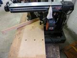 CRAFTSMAN 10 INCH Radial Arm Saw with stand, however it does not have a table stand. Includes Craftsman vacuum attachment. Key included, it is in working condition. Previously Used