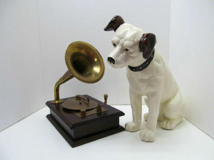 Really cool RCA mascot "Nipper" listening to "His Master's Voice". This depicts what RCA used on many of the old record labels. The musical box plays a few cords then stops until wound again. The dog is approx. 12h.