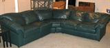 Dark green leather corner couch by DeNuvo. Separates into 2 pieces for transport. Each section 30x90x34. REALLY comfortable. Some scuffs on base and back.