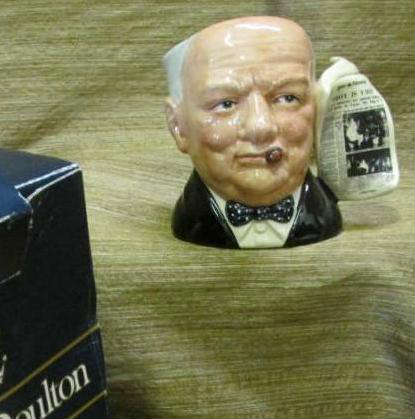 This is a very special small character jug of the Great Winston Churchill, by Royal Doulton. Modeled by Stanley James Taylor. You will find this one is signed on bottom and in free of chips and cracks. Original box is included with this 4" jug