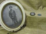 This may be a later print of a civil war photo, enclosed in white wood frame, loose on back side, measures 11" x 9". Also an old pocket watch in silver tone metal. Photo of inside shows missing hands and not in running condition. Included is a unique coin offering the holder "one hour with Nancy" at the Stagehopn' Saloon, Killeen Texas. Dated 1872. Metal is unknown. Also in a separate photo, a framed print of the Appomattox Court House signing for the end of the Civil War. There is water stain on bottom, it is under glass and in wooden frame.