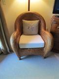 A fabulous wicker arm chair that looks like it should be in Key West! It could not be more stylish. It is 33" wide, 39" deep and 35" high at its back. It has an off white duck cloth covered cushion and you will get the nice throw pillow, too.