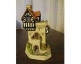 One David Winter Cottage in original box with certificate of authenticity. "Knight's Castle - June" with no apparent damage. Marker shown for size.