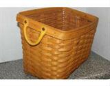Large Longaberger basket with leather handles and a plastic liner. Measures 16x11x12