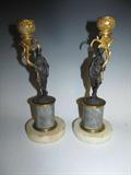 A fabulous pair of French bronze dore or ormolu candelabra. One is slightly taller than the other (9.75" and 9.5"). Each features a lovely cast bronze draped lady holding a gilded bronze candleholder that is exquisitely cast in a floral pattern. And each sits upon a gray marble plinth with a white marble base.  This pair is circa mid to late 1800's. 
Condition: except for age expected issues (small marble flakes and stains, and one of the candleholders is a bit loose), the pair is on good condition.