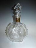 A French Baccarat Louis XIII Remy Martin Grande Champagne Cognac bottle with fleur de lis stopper. It is .75L and 11" high with its stopper, and it is marked Baccarat Cristal. 
Condition: very good with no chips or cracks.