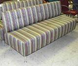 Carolina contemporary style 3-cushion arm-free striped sofa with metal feet. Excellent condition. Approx. 73L. Left wall center section.