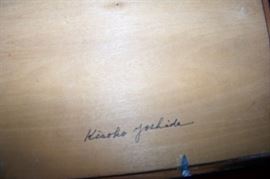 Both pieces are signed on the back