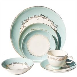 Collection of Lifetime China Co. Semi-Vitreous in Gold Crown: A seventy-six-piece collection of Lifetime China Co. Semi-Vitreous Dishes in Gold Crown. This collection includes thirteen dinner plates, fifteen salad plates, seven dessert bowls, twenty saucers, and twenty-two tea cups. Gold Crown features a gold tone floral motif on white and teal dishes and a gold-tone trim. Each dish is marked “Lifetime China Co., Semi-Vitreous, Alliance, Ohio, Gold Crown”.