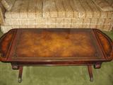 Coffee Table, beautiful carved legs and supports, leather inset on top, by Weimen