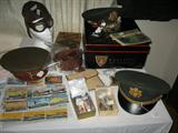 WWII items including officer's hats, aviator's hat, badges, pins, cards