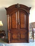 Armoire in living room.  Currently used for television and components, has shelf to use for bedroom. Drawers and shelves make it a multi-functional piece.