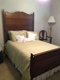 Beautiful Oak full-size/double bed. Headboard with detailing, footboard, wooden rails and mattress/box springs.
