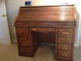 Oak rolltop desk.  Everything works well, easy pull out drawers, interior storage compartments.