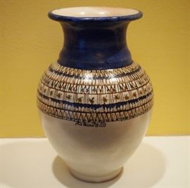Lot 93: A contemporary painted pottery vase. Urn-form, decorated in blue, tan and green on an off-white ground. Illegibly signed at the side. Probably Polish. Good condition. 7 1/2" high. ESTIMATE $40-60