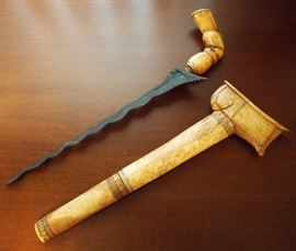 Lot 67: An Indonesian Kris with sheath. Bone grip and sheath. Sheath is separating in two places. 17 1/2" long overall. ESTIMATE $100-200