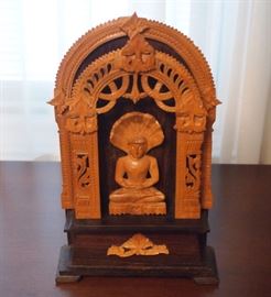 Lot 98: An Indonesian carved wood Buddha enshrined. Depicted in meditative pose. Light hardwood shrine with rosewood base. Good condition. 5 3/4 X 9 1/4" high. ESTIMATE $40-60