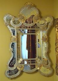 Lot 21: A Venetian etched glass mirror. Cartouche shape frame with etched flowers and scrolls about, applied moldings, flowers and leaves. Good condition. 32 x 49" high. ESTIMATE $800-1,200