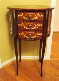 Lot 53: A European marquetry-inlaid occasional table. Louis XV style, fitted with three drawers and ormolu mounts. Good condition. 17 x 27 1/2" high. ESTIMATE $200-300