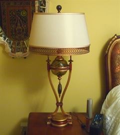 Lot 75: A Fine Art Lamps decorated metal and glass table lamp with silk shade. Bronze and copper color, with a taupe shade. Labeled: Fine Art Lamps. Good condition. 35" high overall. ESTIMATE $100-200