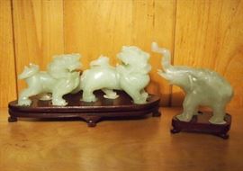 Lot 78: Two Chinese serpentine figures. Including a group of two Fu lions, 6 1/4" long, and an elephant, 3 1/2" high. Each is raised on a separate wood base. Good condition. ESTIMATE $100-200