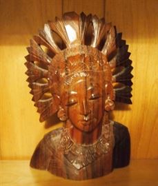 Lot 100: An Indonesian carved wood bust. Female with radiating headdress, in two-tone wood, possibly rosewood. 5 1/4 x 7 3/4" high. Good condition. ESTIMATE $40-60