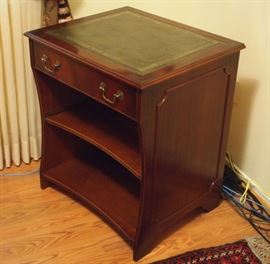 Lot 83: A mahogany desk/printer stand. Inset tooled leather top above a faux drawer front that hinges open to a slide, two open shelves below, one of which slides out. Good condition. 26 x 22 x 31" high. ESTIMATE $100-200