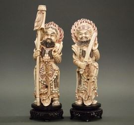 Lot 85: A pair of Chinese decorative warrior deity figures. Composition with polychrome accents, each is depicted standing with weapon. Two very fine cracks noted to the shoulder of one figure, and its base is damaged at one support; the other figure is in good condition. Mounted on wood bases, 11 3/4 and 13 1/4" high overall. ESTIMATE $100-200