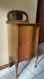 Solid Oak Music Cabinet. Door slightly crooked. Shelves inside. 42 tall, 20 wide and 13.5 deep $80