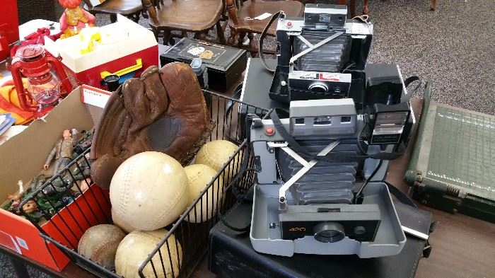 polaroid cameras and cases....softballs and mitt