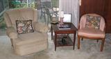 Coral upholstered club chair with mahogany occasional table