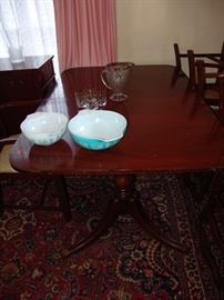 Mahogany Duncan Phyfe style dining table with leaves and pads