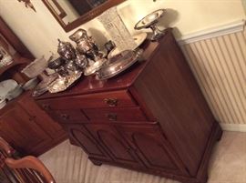 Buffet with Silverplate serving pieces & old glass vase