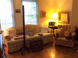 Tv room with hat rack, couch  & chair