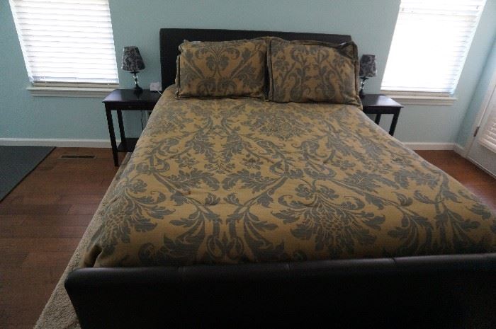 Leather queen size sleigh bed (mattress not included); night stands