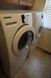 Samsung front loading washer and dryer (both with laundry pedestal under washer/dryer storage drawer)