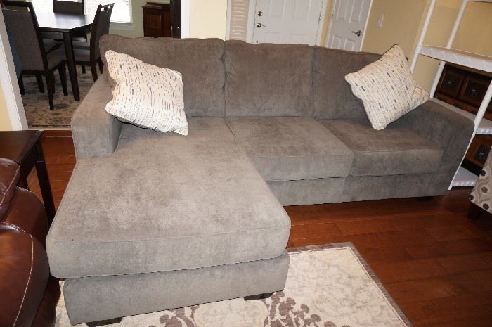 grey sofa with chairse